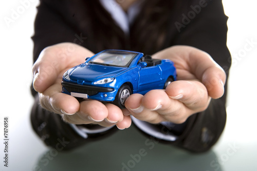 businesswoman holding car in the hands - insurance or car busine © Mario Lopes