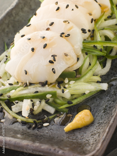 Sashimi of Dive Scallops Cucumber Mouli and sesame salad photo