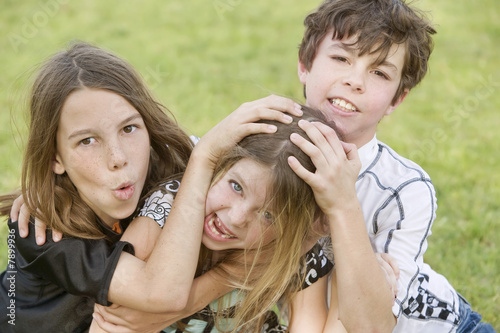 Sibling Playing Roughhouse photo