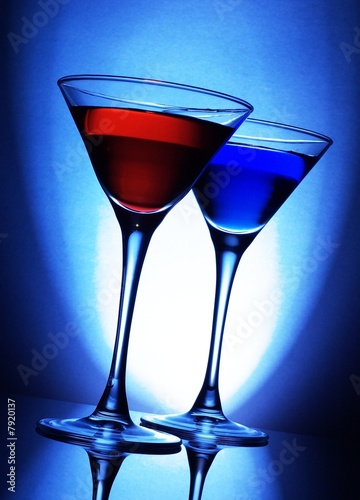  Red and blue cocktails on blue background