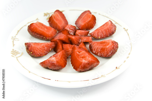 Sliced strawberries on plate