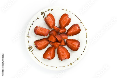 Sliced strawberries on plate
