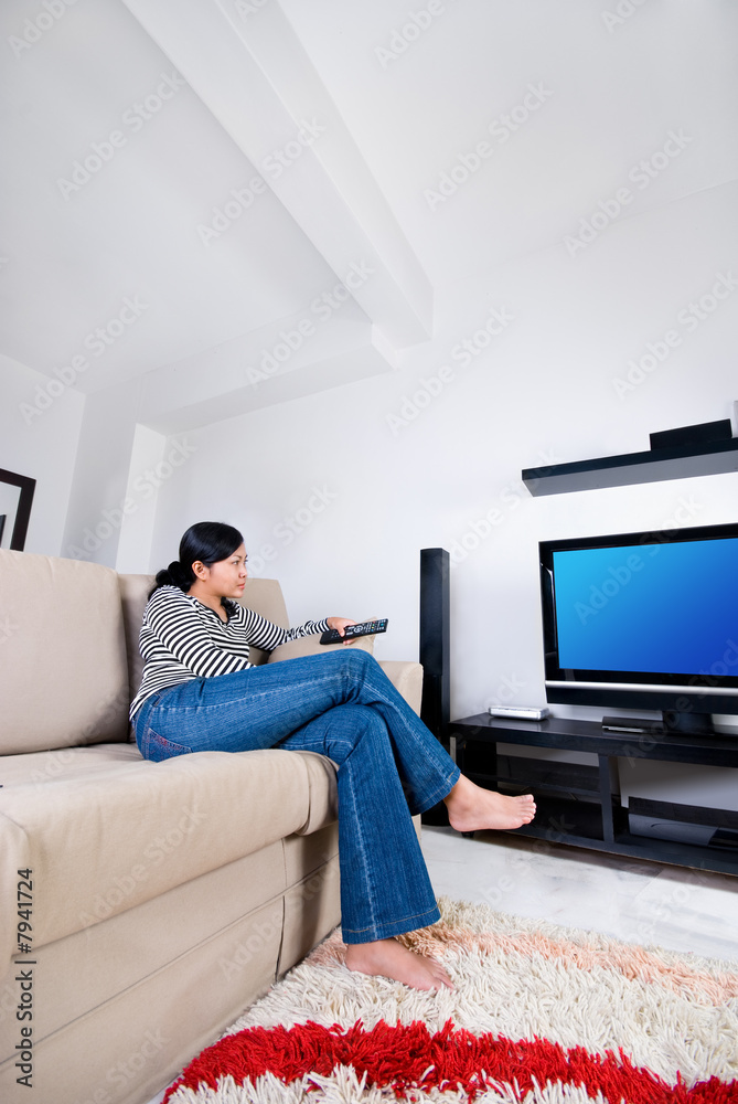 Women watching television at home Women watching television at home