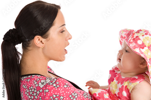 A mother teaches his daughter to speak