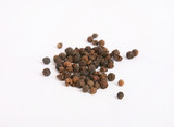 Black pepper in close-up isolated on white background