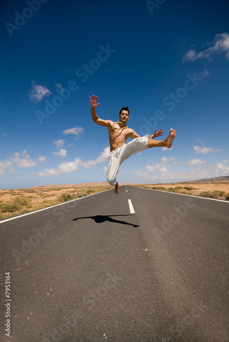 man on the road jumping