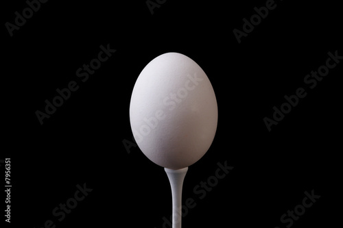 Egg on golf tee with clipping path