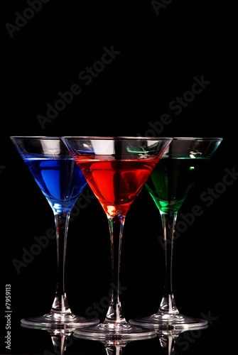 Blue, red, and green cocktails on black background