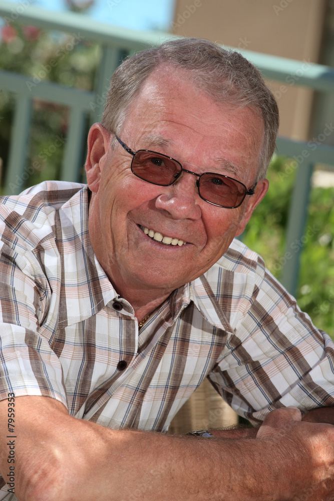 handsome senior man smiling relaxing outdoors handsome senior man smiling relaxing outdoors