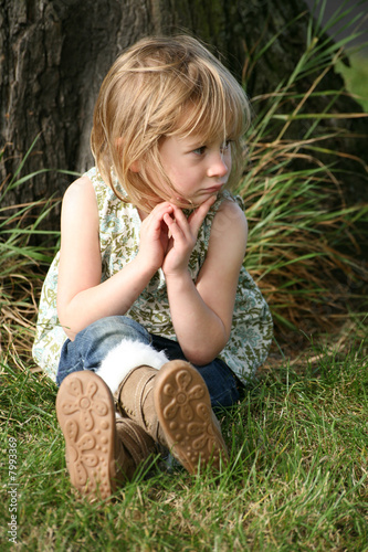 Child looking thoughtful, sad and upset