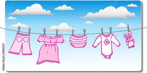 baby girl clothing hanging on the clothes line with clouds