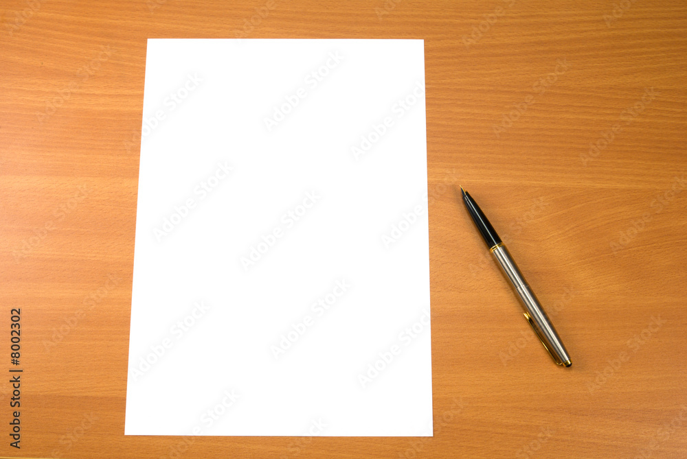 Blank paper sheet and pen on wooden table surface. Blank paper sheet and pen on wooden table surface.