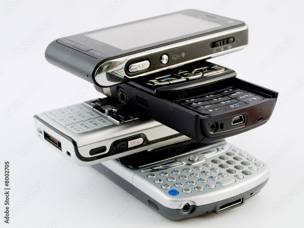 Stack Pile of Several Modern Mobile Phones PDA Cell Handheld Uni Stack Pile of Several Modern Mobile Phones PDA Cell Handheld Uni