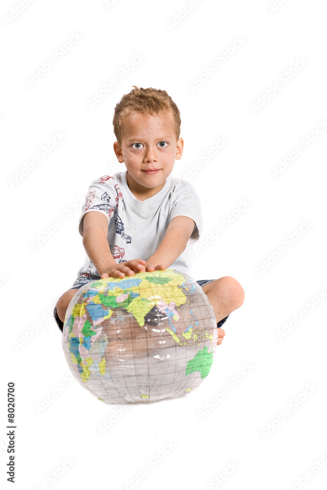 Young boy plays with globe - isolated on white Young boy plays with globe - isolated on white