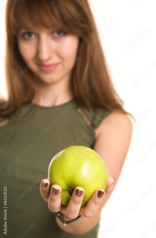 Fitness girl with green apple, focus on fruit Fitness girl with green apple, focus on fruit