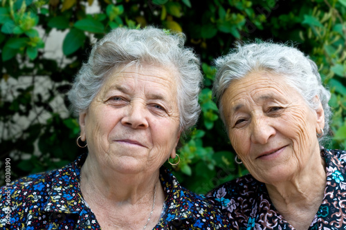 Two happy smiling old ladies photo