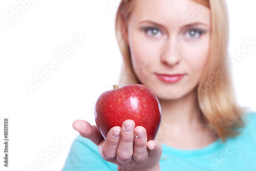 The girl with a red apple on a white background