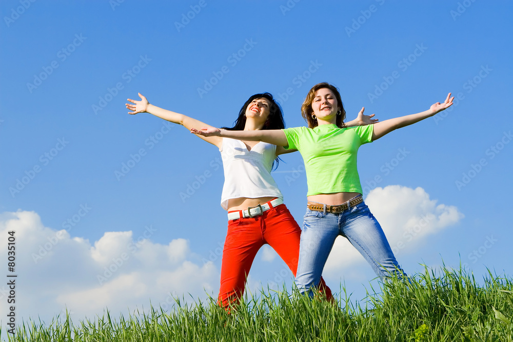 two happy young women dreams to fly on winds two happy young women dreams to fly on winds