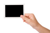 Hand holding a photograph isolated on a white background