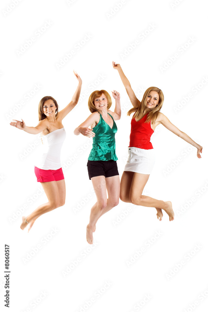 three beautiful smiling women are jumping isolated three beautiful smiling women are jumping isolated