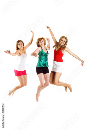 three beautiful smiling women are jumping isolated