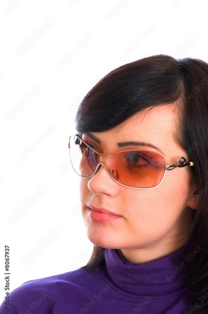 Young girl in sunglasses isolated on the white Young girl in sunglasses isolated on the white