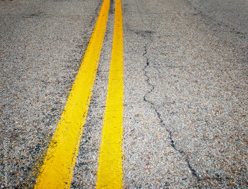 yellow dividing lines on the highway. © javarman