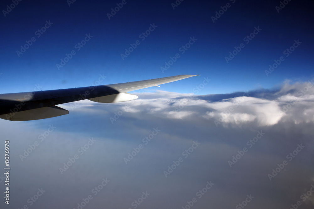 Fototapeta premium blue sky and aeroplane wing - vacation concept
