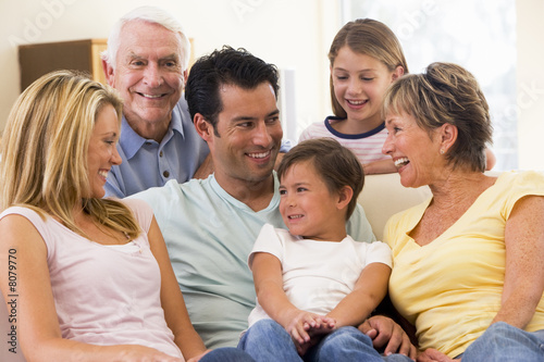 Extended family in living room smiling © Monkey Business