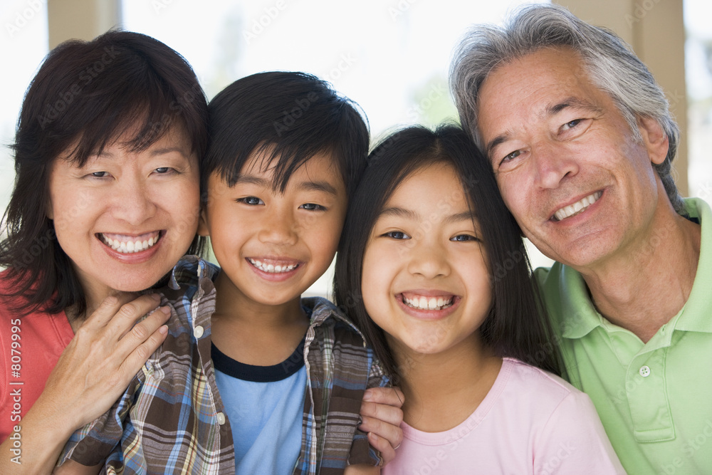 Fototapeta premium Grandparents posing with grandchildren
