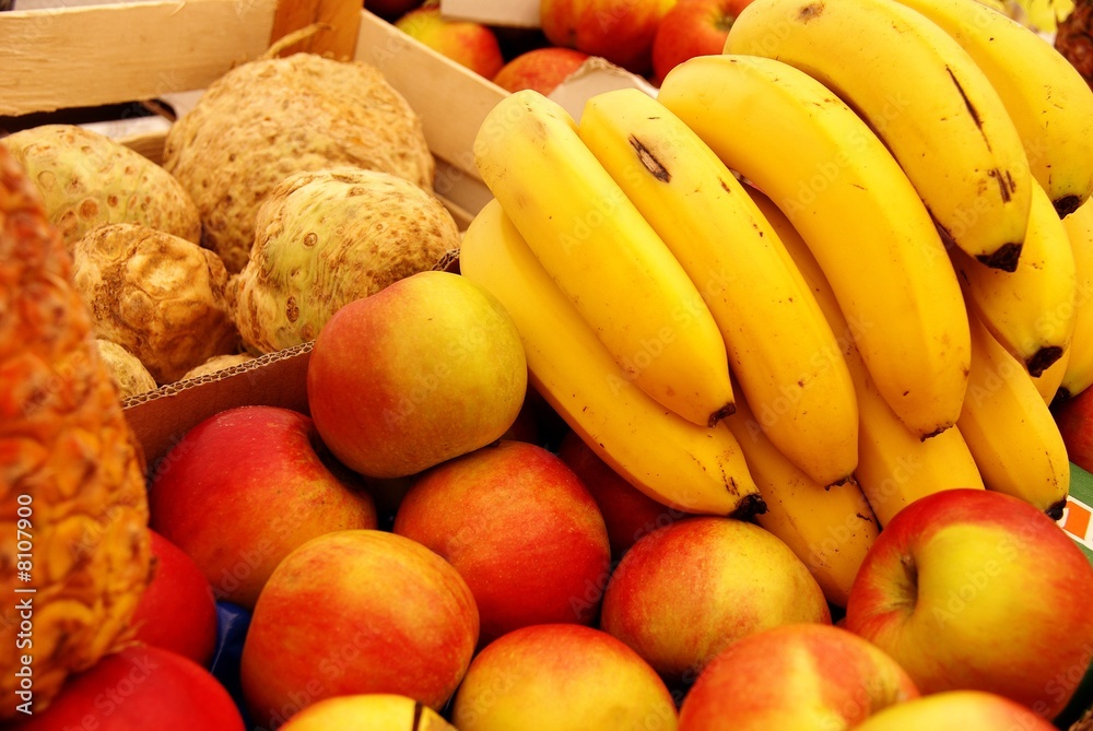 Apples, tubers, banannas and a pineapple at the market Apples, tubers, banannas and a pineapple at the market