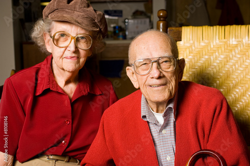 Senior Man and Woman Sitting  Holding Hands.  Pleasant 