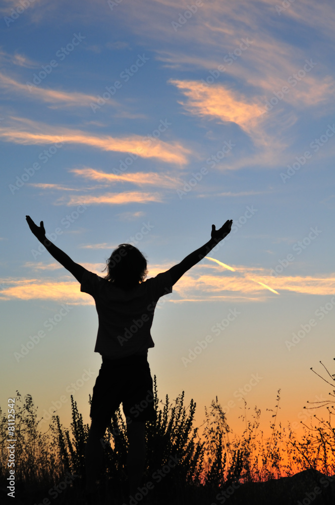 Triumphant man at sunset Triumphant man at sunset