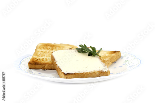 toast with butter on plate isolated on white background