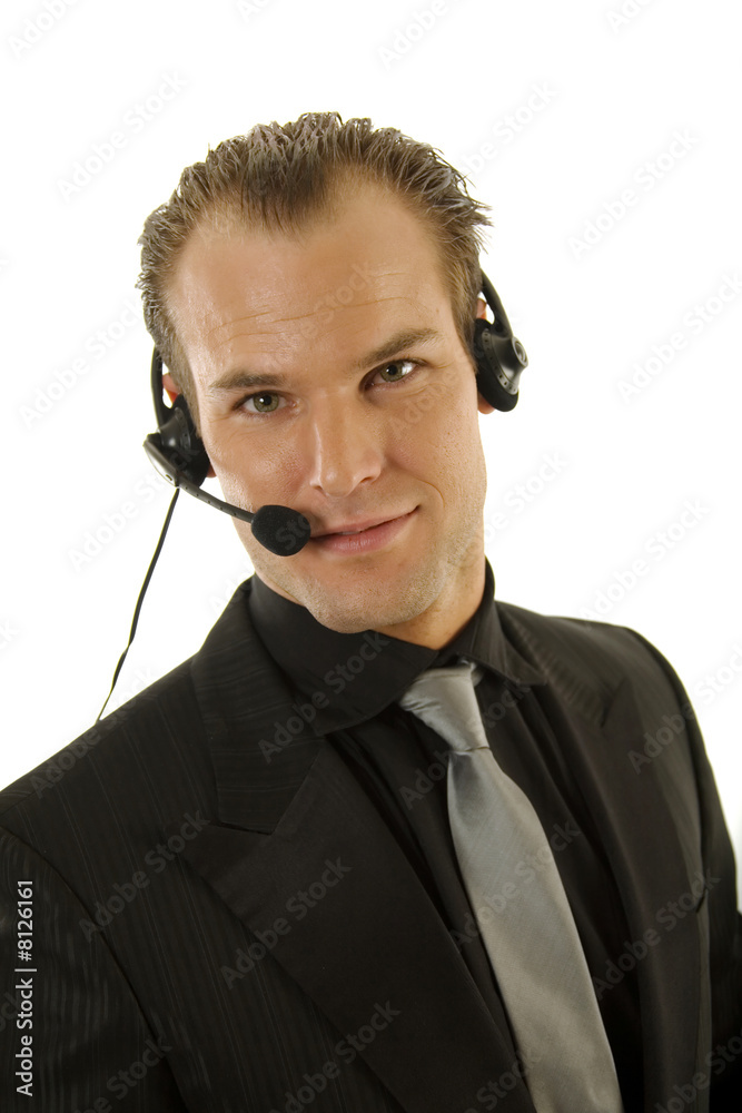 Successful young businessman wearing headphones Successful young businessman wearing headphones