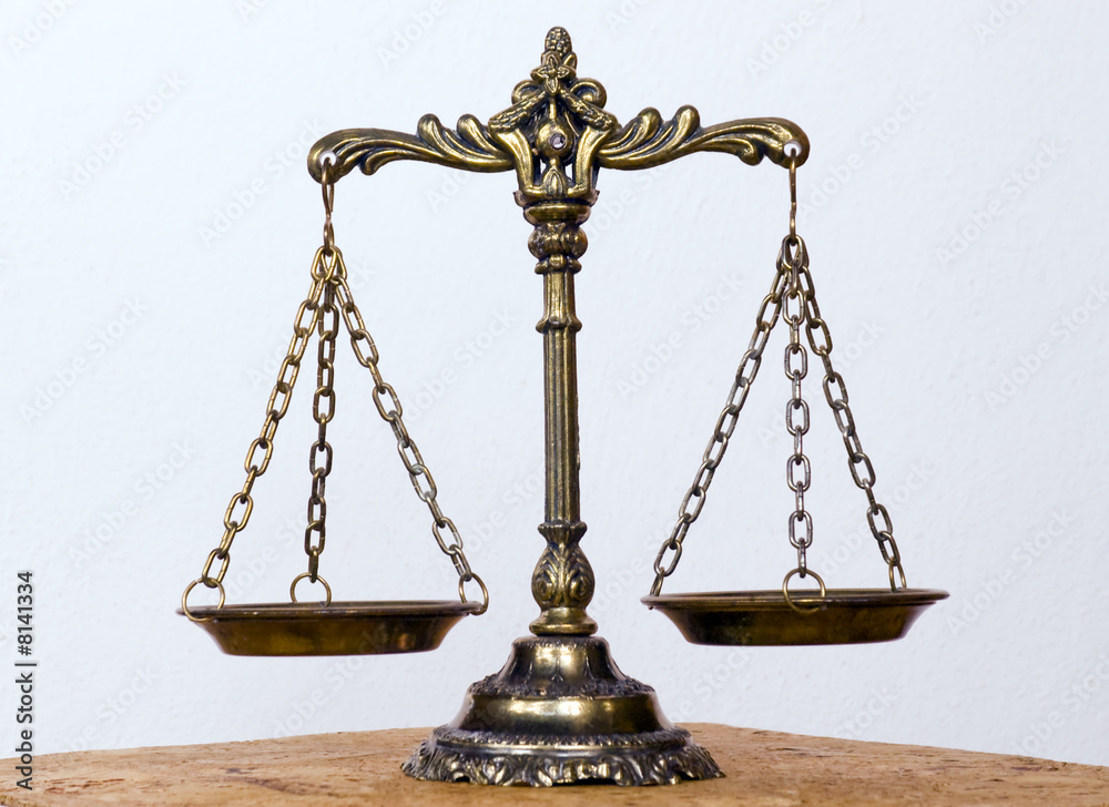 A photo of the scales of justice with a balance theme overlay A photo of the scales of justice with a balance theme overlay