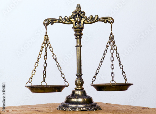 A photo of the scales of justice with a balance theme overlay