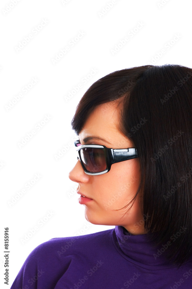 Young girl in sunglasses isolated on the white Young girl in sunglasses isolated on the white