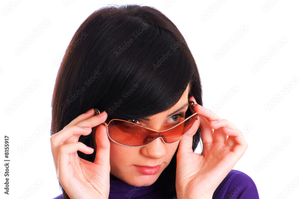 Young girl in sunglasses isolated on the white Young girl in sunglasses isolated on the white