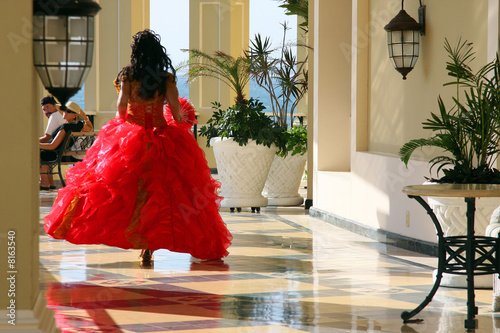 Beautigul woman in gown in a hurry