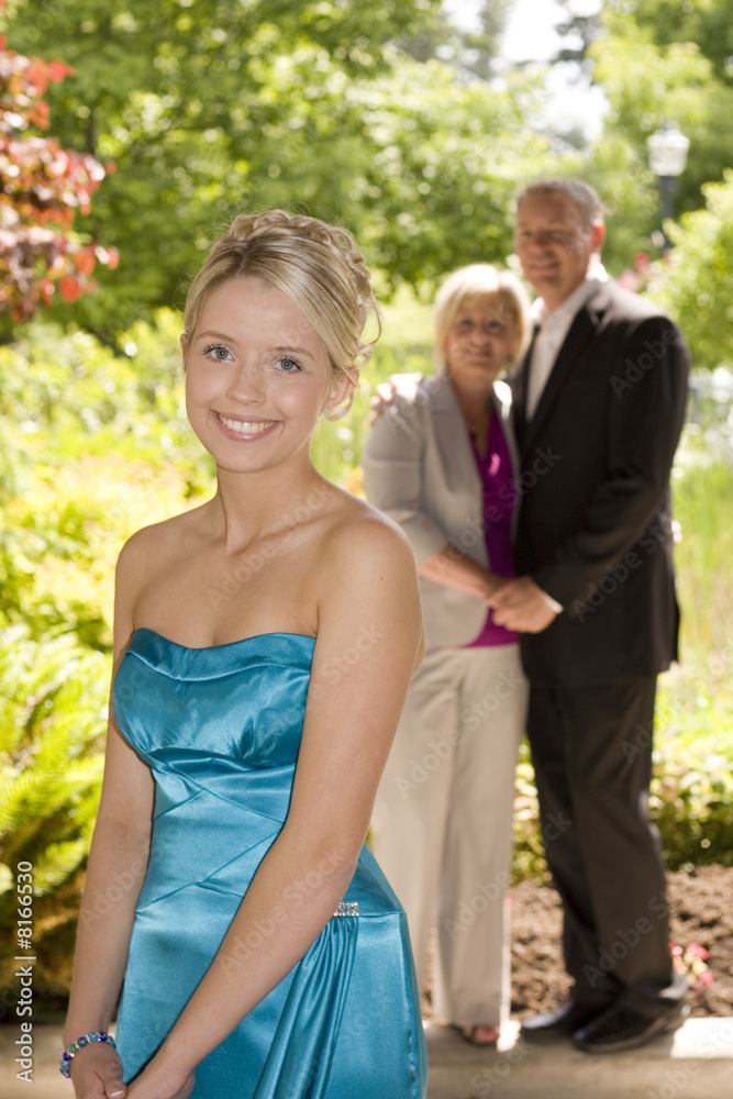 Proud parents and their beautiful teenage daughter. Proud parents and their beautiful teenage daughter.
