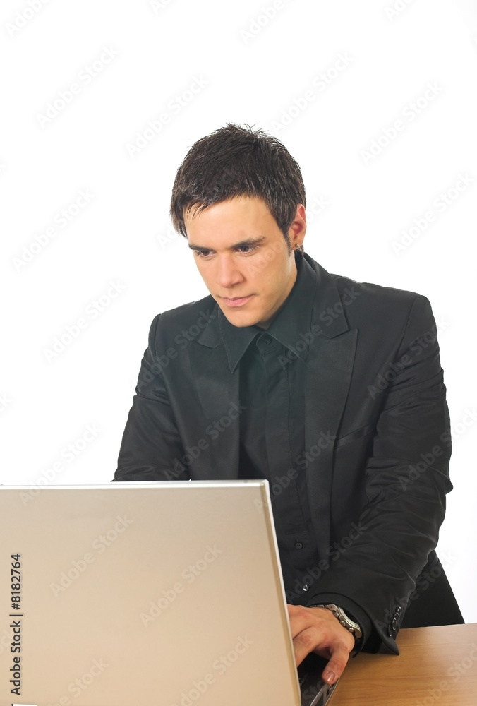 Young businessman working on laptop computer Young businessman working on laptop computer