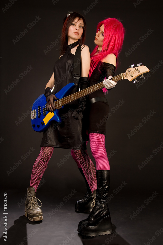 Fototapeta premium Two rock girls with bass guitar