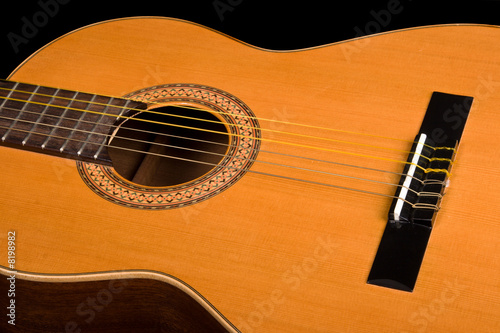 Classical guitar close up on dark