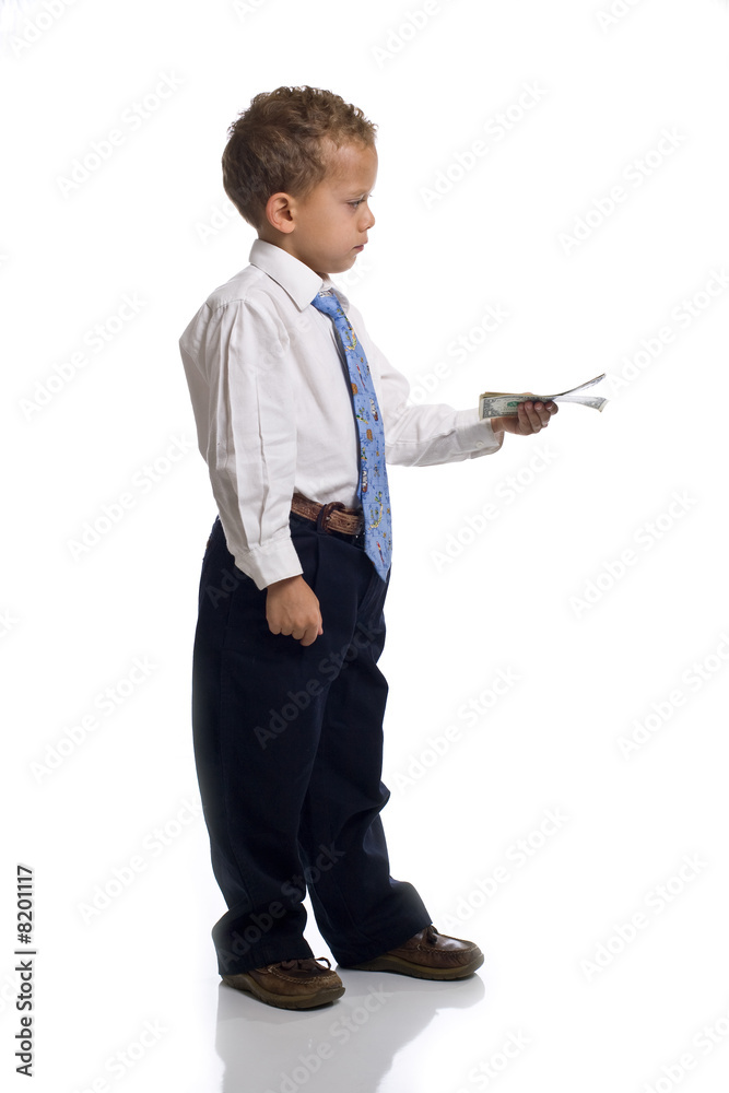 Young boy dressed as businessman holds money - isolated on white Young boy dressed as businessman holds money - isolated on white