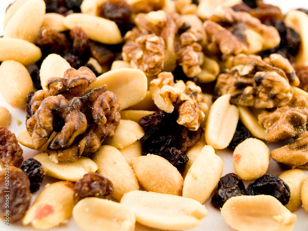Close Up Walnuts Peanuts and Dried Fruit on White Background Close Up Walnuts Peanuts and Dried Fruit on White Background