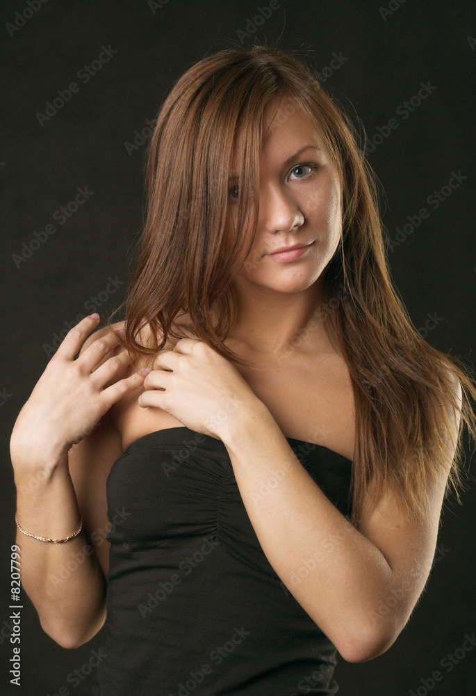 Fototapeta premium Young woman portrait, studio shot