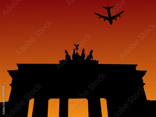 plane and Brandenburg gate Berlin