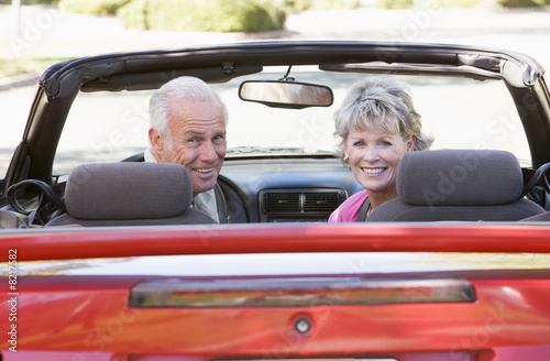 Couple in convertible car smiling © Monkey Business