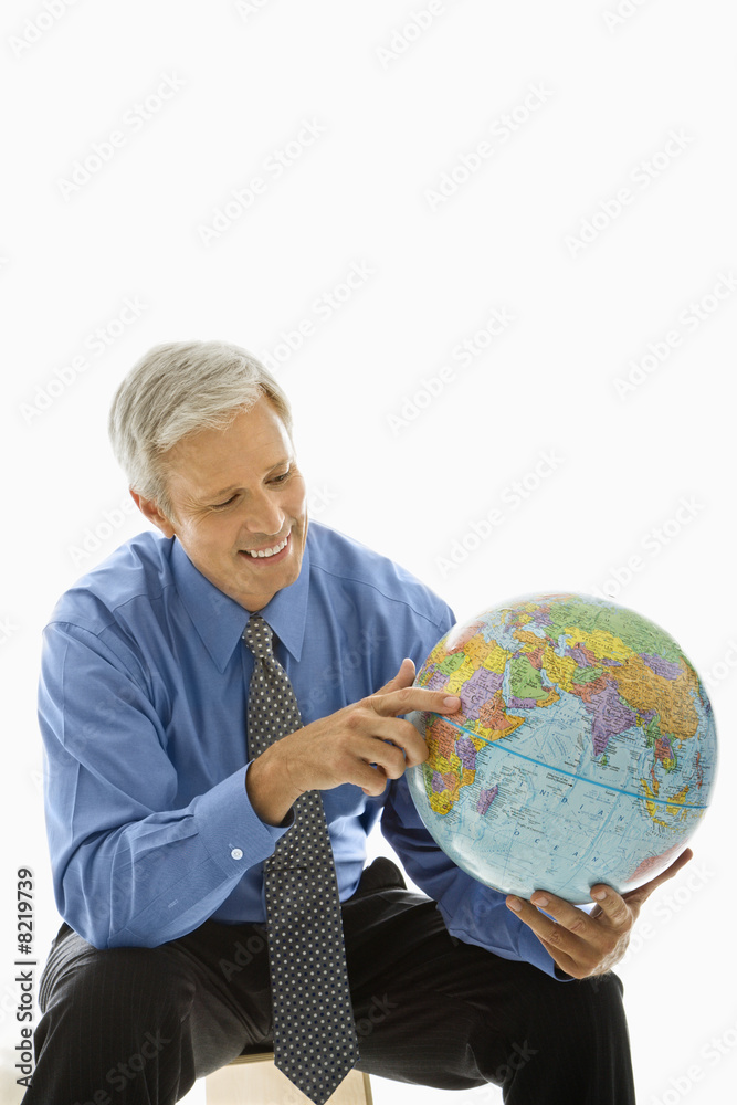 Man pointing on globe. Man pointing on globe.